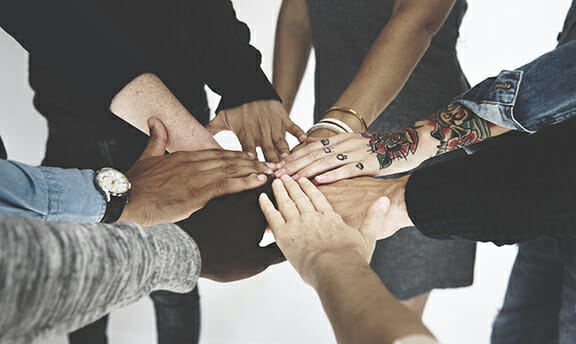 Group of Diverse People Hands Together Teamwork